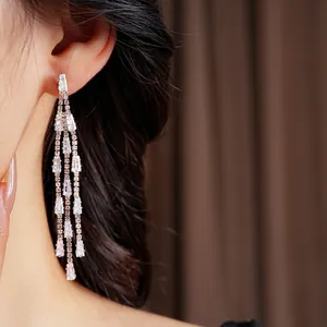 Elegant rose gold fringe earrings with baguette cut crystals for formal occasions