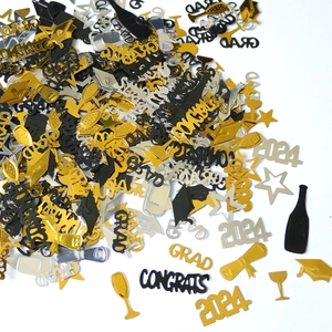 Macro shot of 2024 graduation confetti featuring Grad and Congrats foil letters