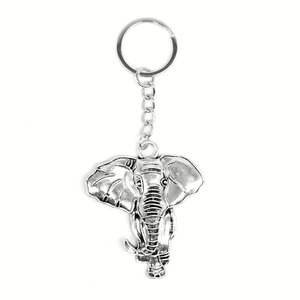 Vintage silver elephant head keychain pendant with antique metallic finish on white background