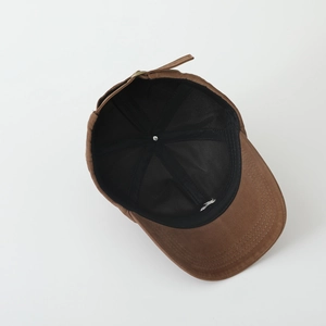 Brown minimalist cotton baseball cap with fox embroidery shown from an inner view