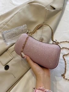 Pink rhinestone evening bag with gold handle and chain strap for elegant dinner parties