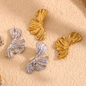 Elegant 18K gold and silver ginkgo leaf earrings with vintage hammered metal texture