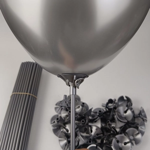 Detail shot of grey balloon stick with cup holder connector for party decorations