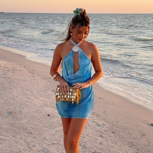 Blue halter backless floral dress with shell details for beach vacation style