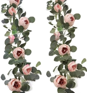 Detail of silk pink rose and eucalyptus garland for wedding background decoration