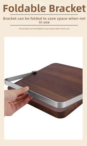 Detail of a foldable magnetic knife holder showing its solid wood base and metal support