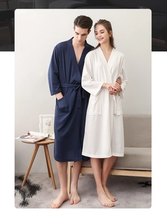 Detailed close-up showing the waffle weave texture and V-neck tie of the cotton bathrobe