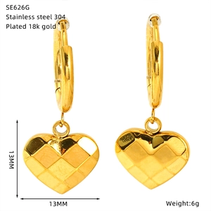 Detailed view of 18k gold plated stainless steel heart earrings with quilted pattern