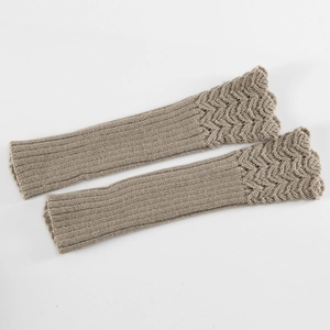 Close-up of khaki knit arm warmers with wavy edges and vertical rib texture
