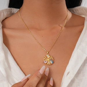 Close-up of 18K gold plated necklace with hollow flower pendant and colorful zircon stones