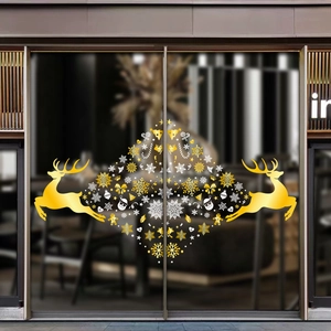 Golden reindeer Christmas window stickers with white snowflakes for festive shop glass decor