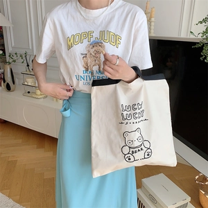 Chic cream canvas tote bag with black bear graphics and lucky text for women