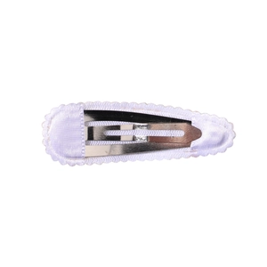 Detail of the white fabric wrapped snap clip with its durable metal base structure