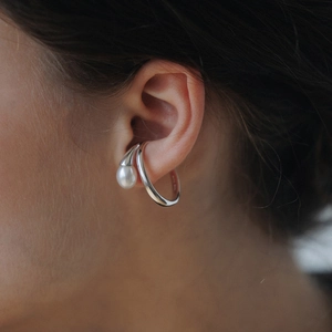 French style 18k gold plated brass ear cuff with white pearl worn by a model