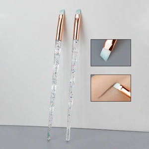 Angled eyebrow brush set with crystal glitter handles and rose gold ferrules detail