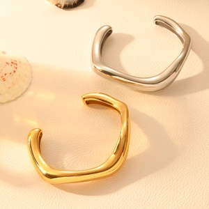 Minimalist wavy open cuff bracelets in gold and silver stainless steel finish