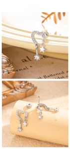 Detailed view of hollow heart stud earrings with cubic zirconia and star charms
