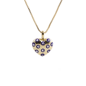 Close-up of golden necklace featuring a purple evil eye heart pendant on white background
