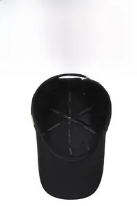 Detail view of the black baseball cap interior with reinforced seams and metal buckle