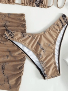 Detail of marble print swimwear with adjustable side drawstring and mesh texture