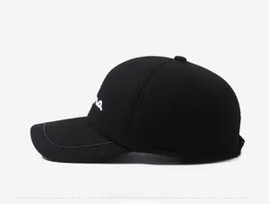 Detail view of winter baseball cap with white embroidery and ear protection flaps