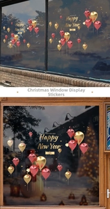 Detail of red and gold 2025 Happy New Year window stickers with festive balloon patterns