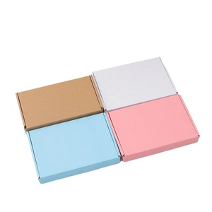 Foldable corrugated shipping boxes in brown, white, light blue and pink colors