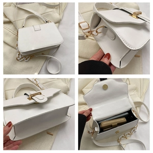 Detail view of white flap crossbody bag showing spacious interior for phone and wallet