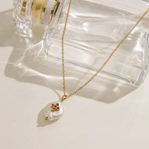Baroque pearl pendant necklace with colorful rhinestones on a gold titanium steel chain