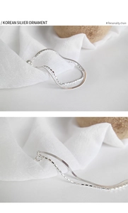 Detail of S925 silver double-layered bracelet with snake chain and square beads