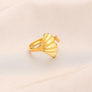Detailed close-up of gold-plated ginkgo leaf ring with intricate leaf vein textures