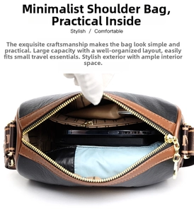 Detail view of large capacity interior with blue lining and logo webbing strap