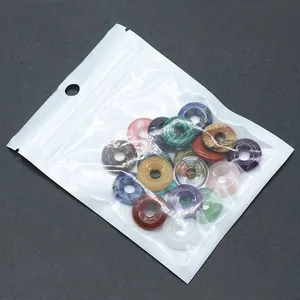 Assorted natural crystal and agate stone pendants in transparent protective OPP bags
