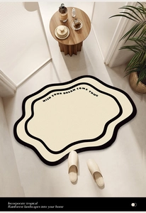 Close-up of fluffy irregular bathroom rug with WISH YOUR DREAM COME TRUE text