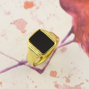 Detail of 18K gold-plated stainless steel ring with rectangular black onyx stone inlay