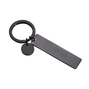 Black stainless steel keychain with rectangle and round tags on white background