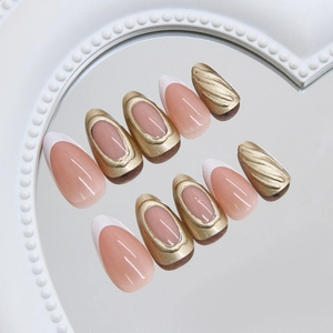French tip press-on nails with golden embossed relief and mirror reflection setup
