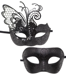 Detail of luxury metal butterfly masks with laser-cut patterns and sparkling rhinestones
