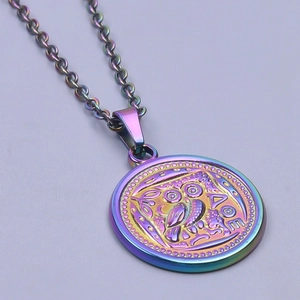 Macro detail of iridescent owl pendant with classic Greek engraving on a steel chain
