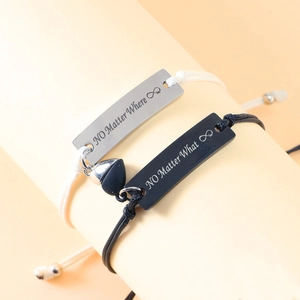 Magnetic couples bracelet set with engraved stainless steel bars and woven rope