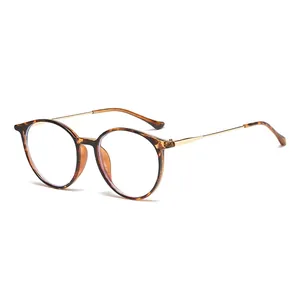 Retro round tortoise shell glasses with thin gold metal temples on a white background