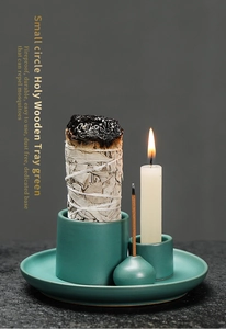Macro detail of a green ceramic holy wood tray and candle holder for home atmosphere