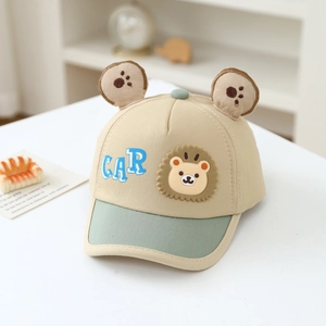 Detail of khaki baby baseball cap with 3D ears and cute car bear embroidery patch