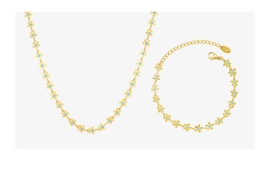 Macro shot of gold necklace and bracelet set with blue floral enamel and K18 hallmark