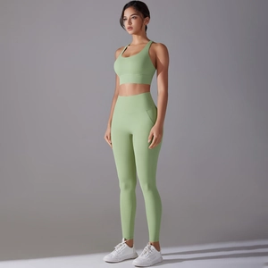 Detail of the high-waisted avocado green yoga set showing side fit and elastic fabric texture