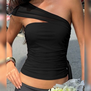 Detail of black one-shoulder top featuring mesh splicing and elegant draped streamers