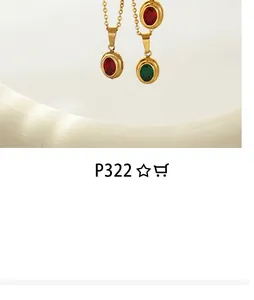 Detail view of retro oval pendants with red and green gemstones on fine gold chains