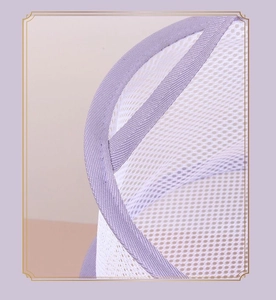 Close-up of white mesh drying net with purple trim for makeup sponges and brushes