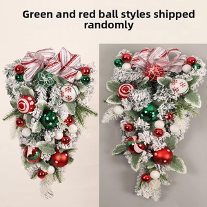Detail of flocked Christmas swag ornaments with colorful balls and large ribbon bows