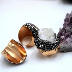 Adjustable gold hammered ring featuring a large pearl white raw druzy quartz crystal